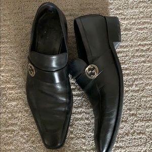 Black Gucci dress shoes with logo